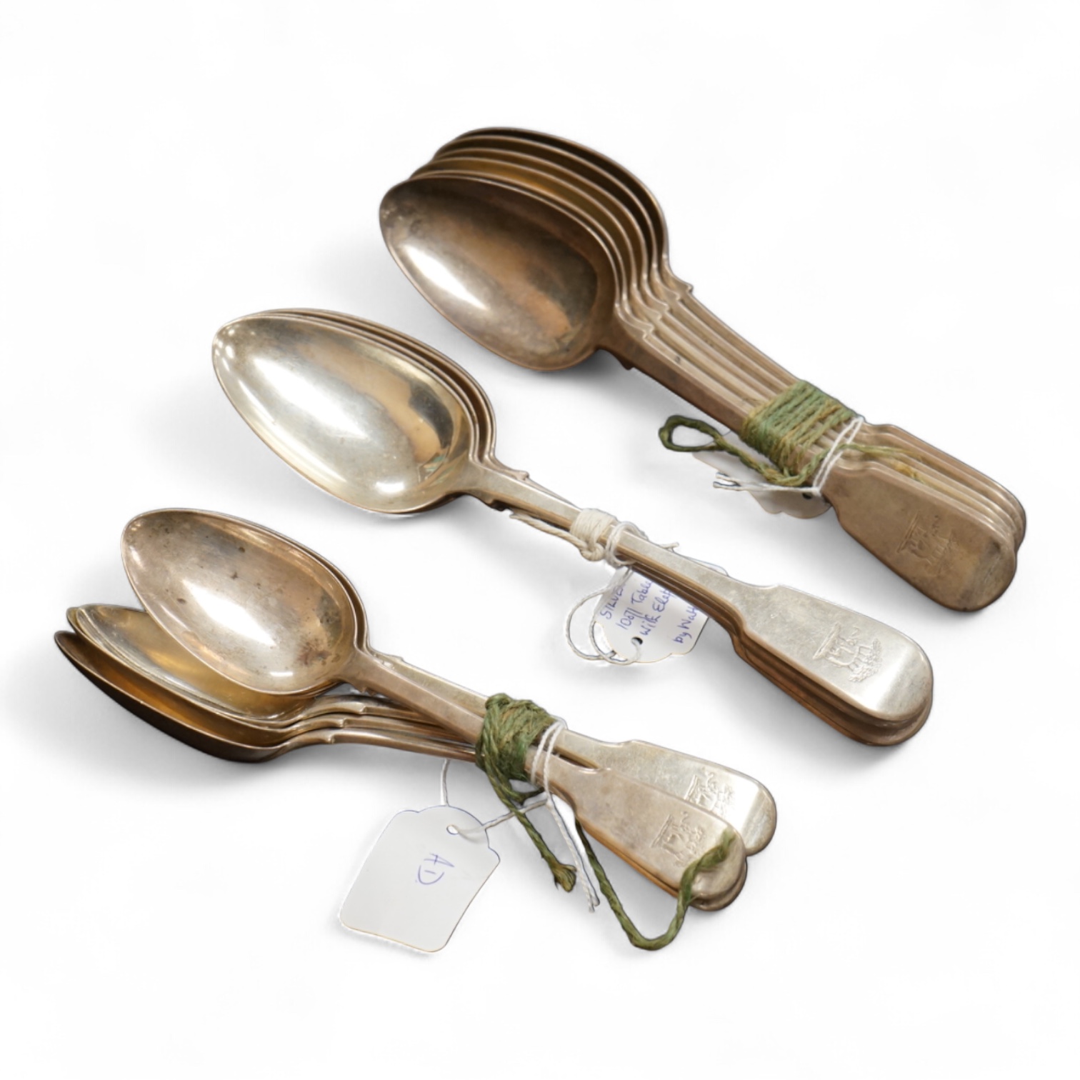 A set of ten George IV silver fiddle pattern table spoons and five dessert spoons by William M. Traies, London, 1829 and one other matched silver dessert spoon, 32.7oz.